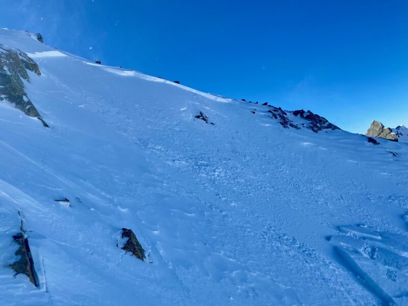 A small pocket of wind slab that released just off the leeward side of the ridge.