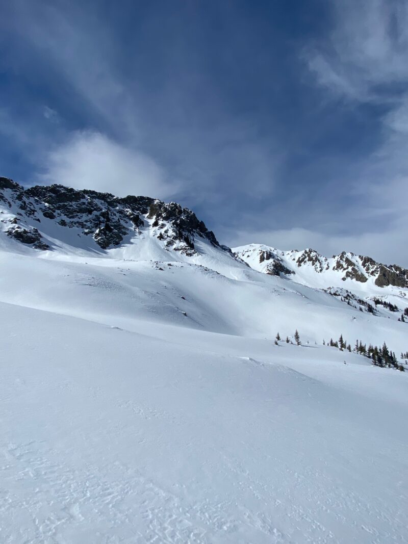 Cross-loaded wind drifted slope on a NE Aspect, It's on wind affected slopes that you are more likely to find a stiffer cohesive slab able to propagate and fail on facets below