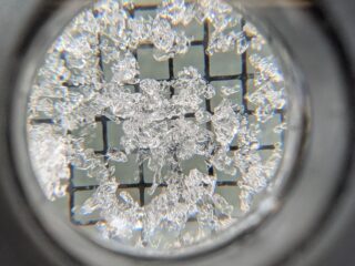 Dec 1, 2025: A cluster of 1-2mm facets pulled from near the ground on a North aspect, 11'4k.  Our November snowpack has started to lose vapor to the cold air and transition to weak, sugary snow. 