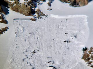 Feb 22, 2026: Human triggered avalanches like this that was remotely triggered from the flats below is possible. taking with it most of the season's snowpack.